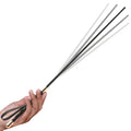 Master Series Sinful Impact Cane: A multi-pronged black and white flexible whip with a gold-accented handle in a hand.