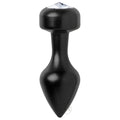 The Master Series Spade Petite Jewel Aluminum Anal Plug is a black, tapered anal plug with a rounded base and clear faceted gem, ideal for temperature play and adding style to your bedroom adventures.