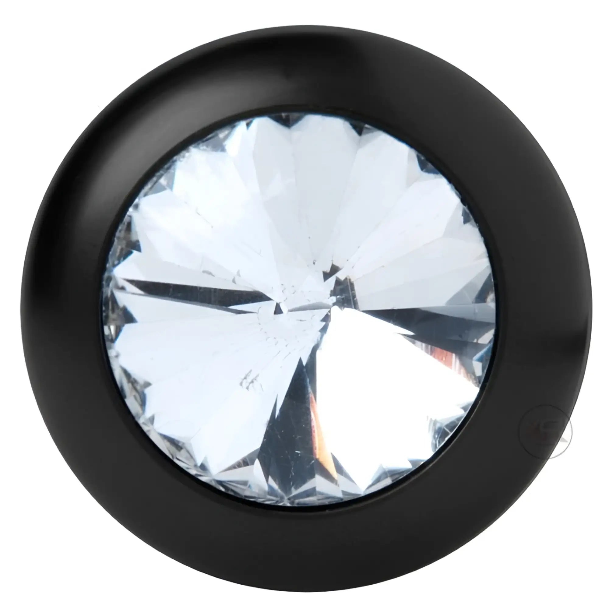 The Master Series Spade Petite Jewel Aluminum Anal Plug is round, black, and features a large clear faceted gemstone at its center for a shiny, decorative look.