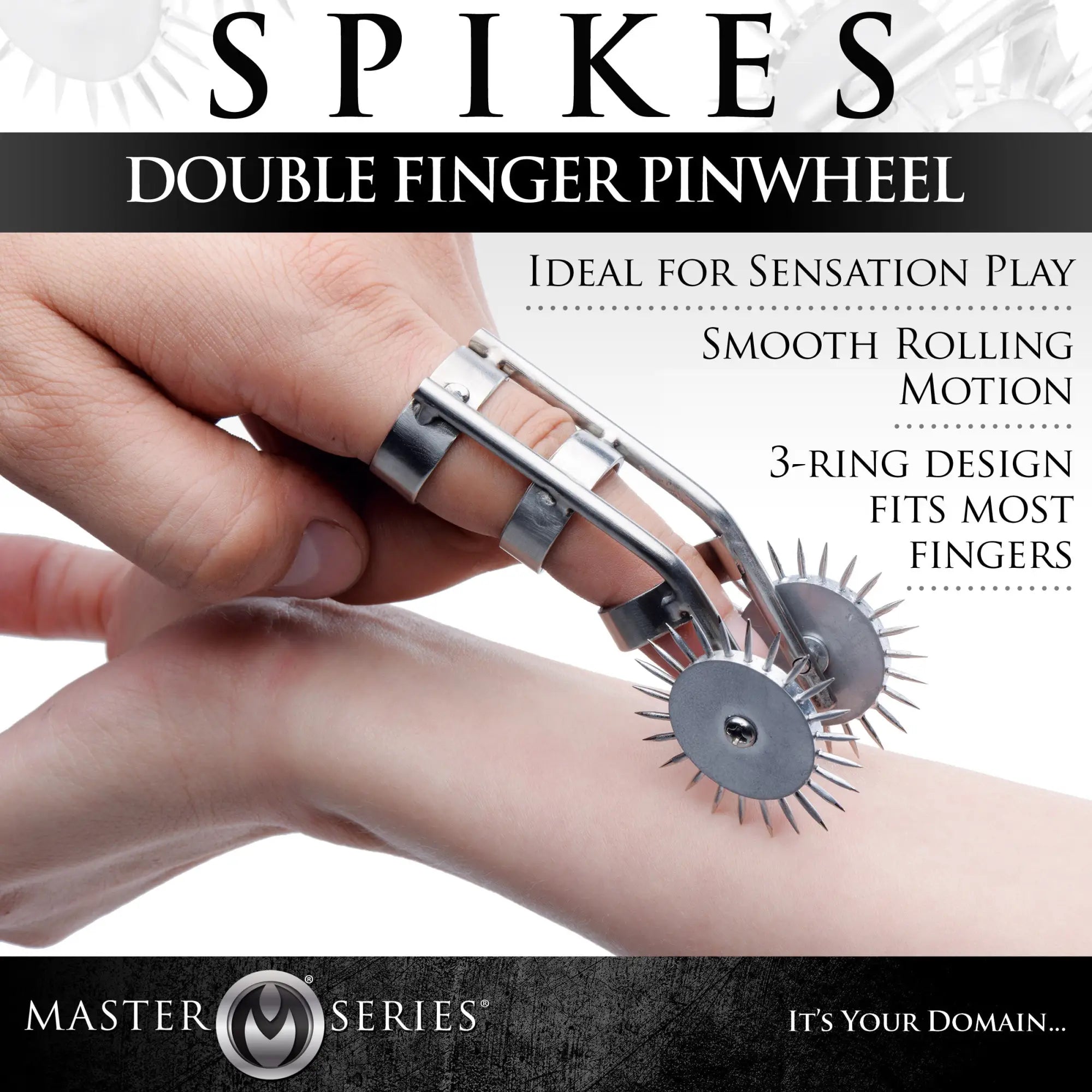 Master Series Spikes Double Finger Pinwheel with silver rings and two sharp rotating wheels worn on a finger.