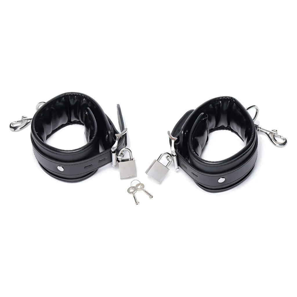 Master Series padded black leather ankle cuffs with silver-tone hardware, padlocks, and keys on a white background.