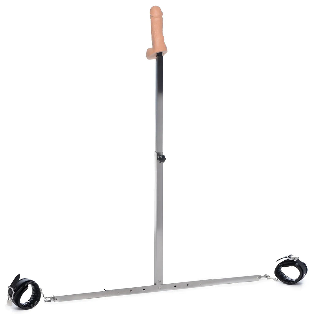 Master Series Squat Anal Impaler: A metal floor-standing post with a flesh-toned dildo, spreader bar, and black cuffs.