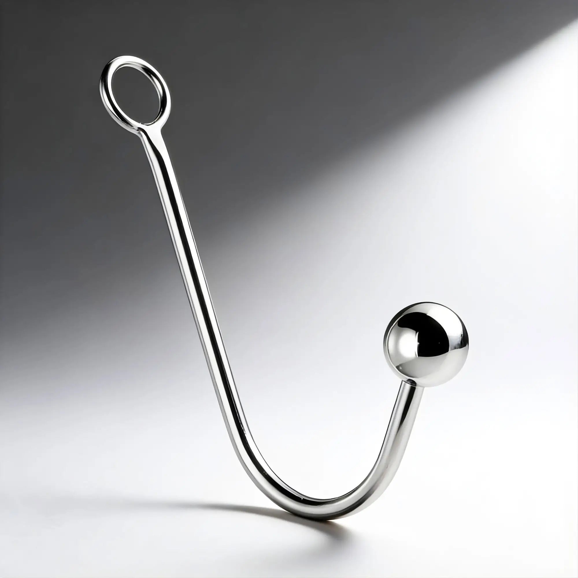Master Series Stainless Steel Anal Hook featuring a polished, J-shaped metal design with a ring handle and ball tip.