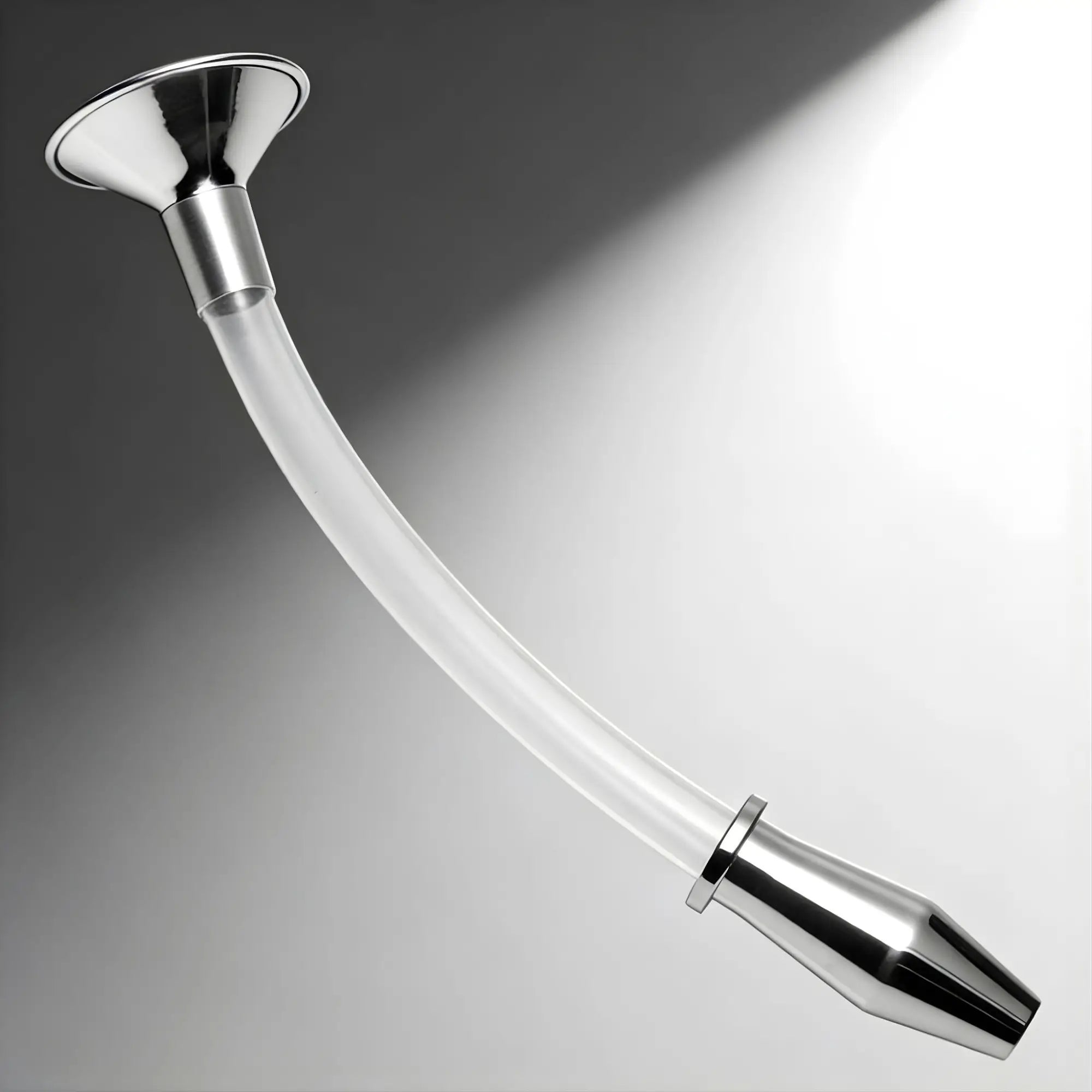 Master Series Stainless Steel Ass Funnel with a clear, curved tube and a metallic hollow anal plug.
