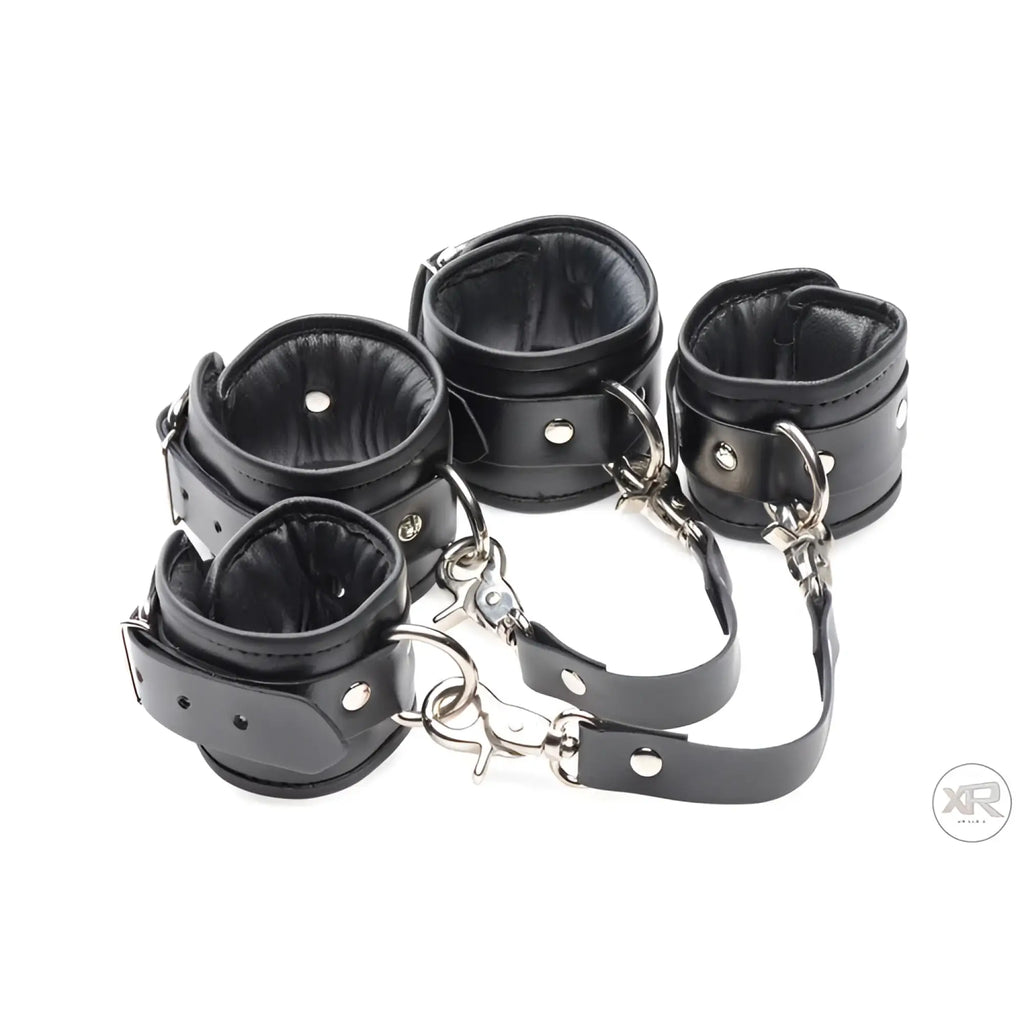 Master Series black leather-style bondage cuffs with metallic buckles, connected by adjustable locking straps.