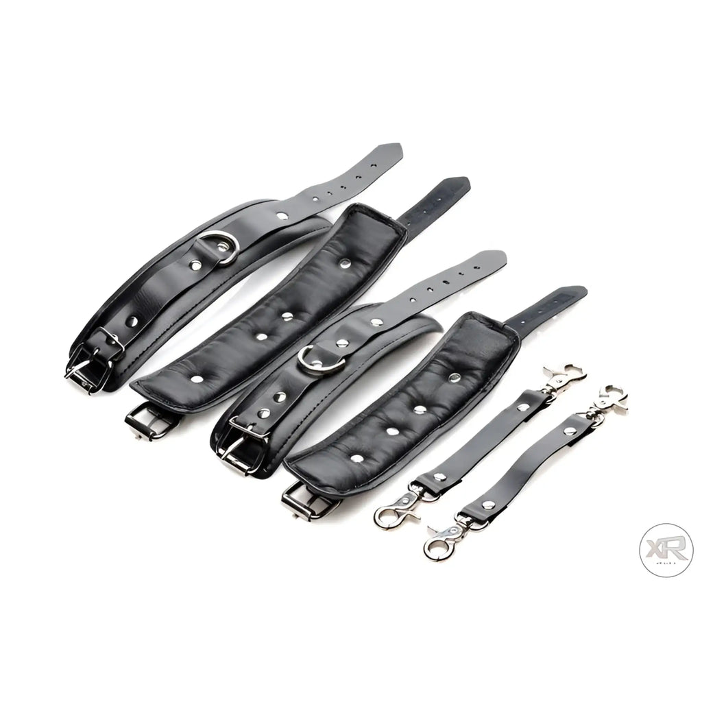 Master Series Strap Linked Bondage Cuffs: four black padded leather cuffs with metal hardware and two connecting straps.