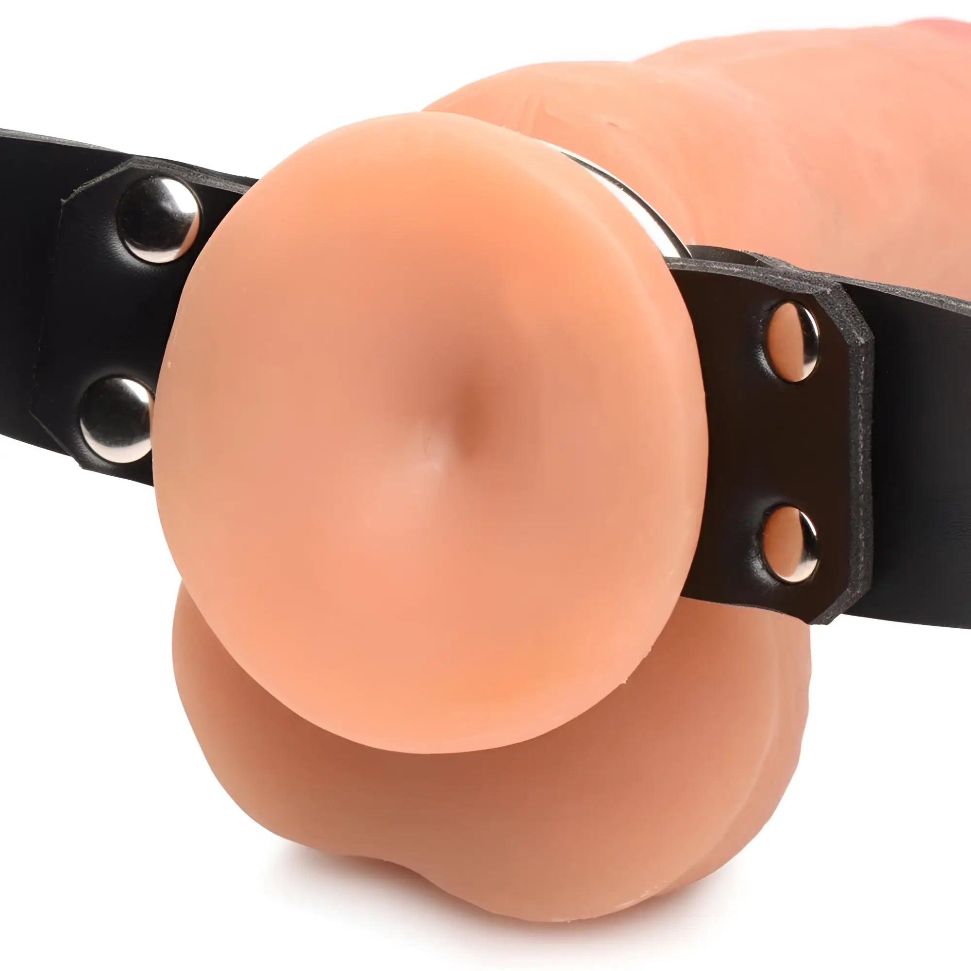 Master Series Strap and Ride dildo harness featuring a realistic skin-tone dildo attached to a black leather-style strap.