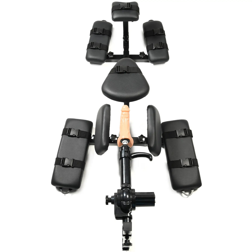 Master Series Subversion Deluxe Stockade with integrated sex machine, featuring black padded restraints on a metal frame.