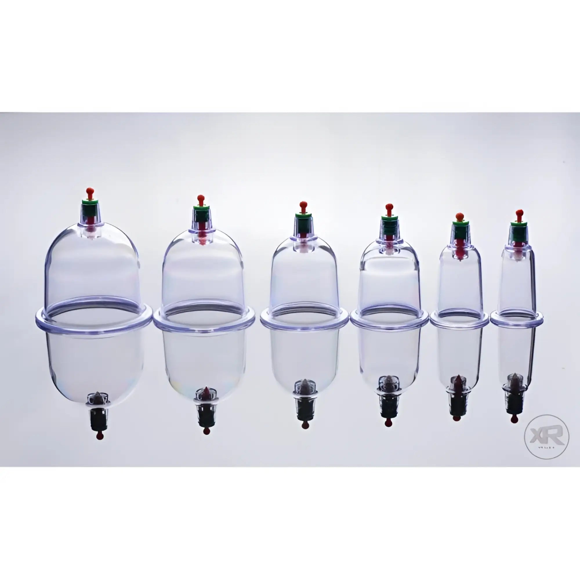 Master Series Sukshen 6-piece clear plastic cupping set with green and orange pressure valves and internal acu-points.