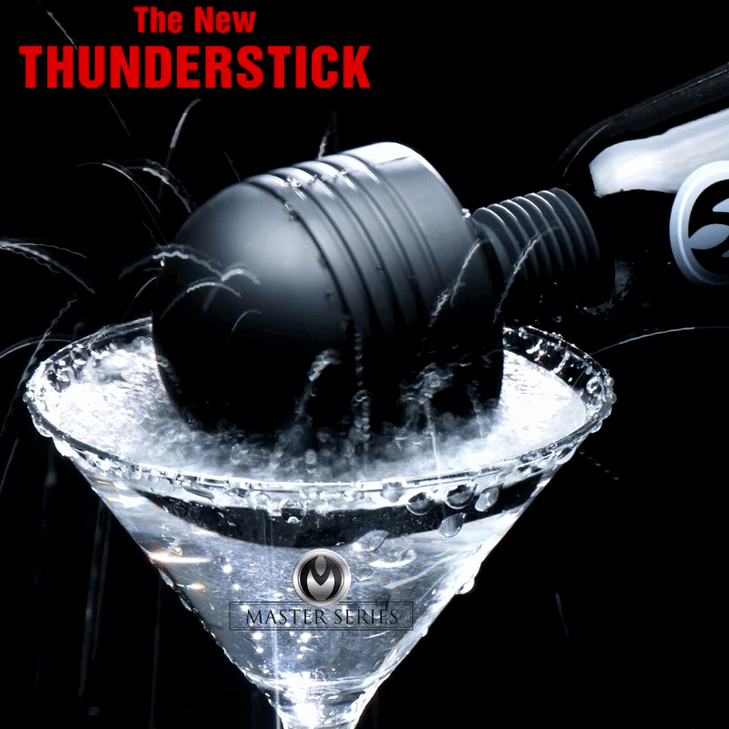 Master Series Super Charged Thunderstick: A black, ribbed power wand vibrating in a martini glass against a black background.