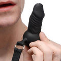 Master Series Suppressor black silicone face banger gag being held near a person's mouth.