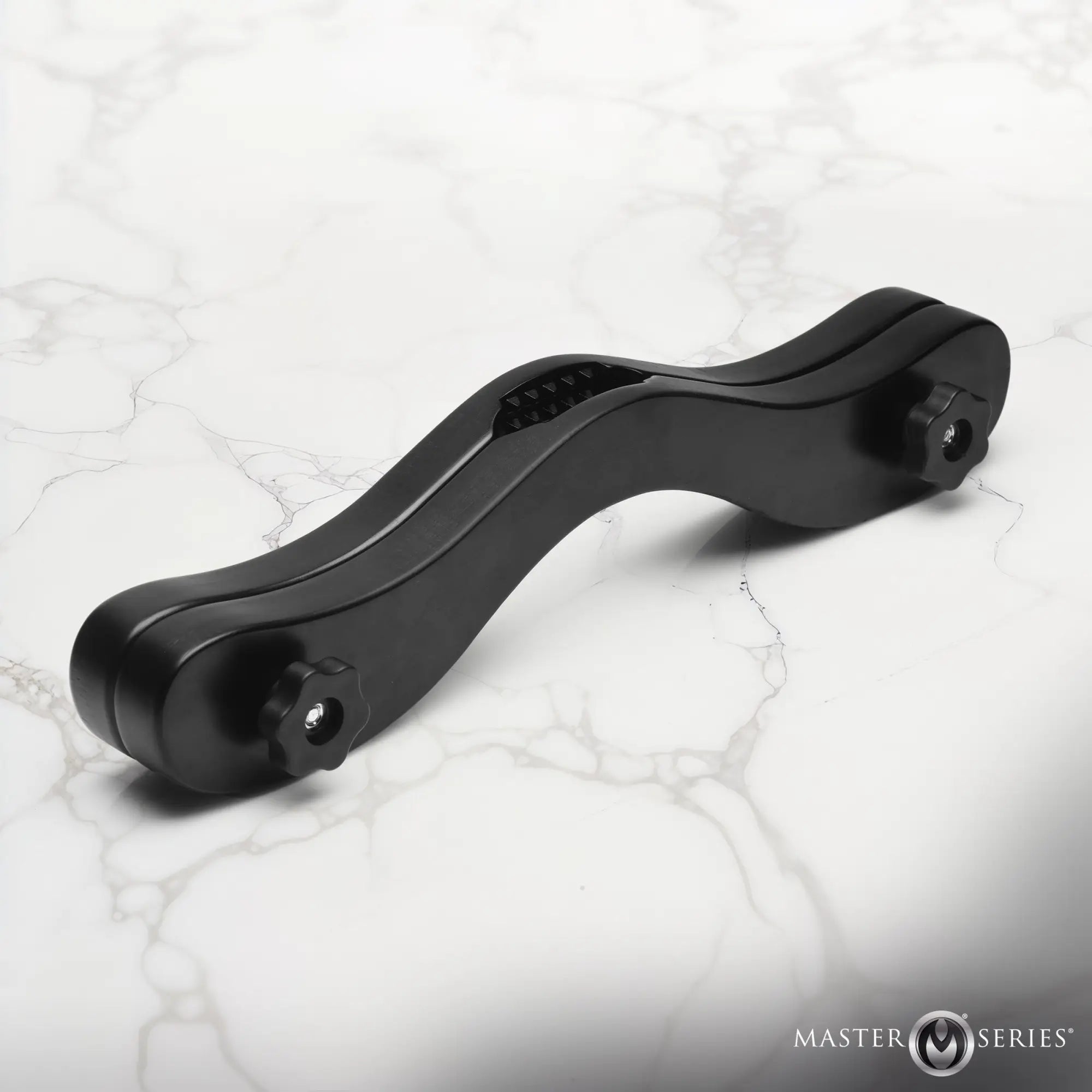 Master Series Thorns Spiked Wooden Humbler: A matte black, wavy-shaped wooden device with metal tension knobs.