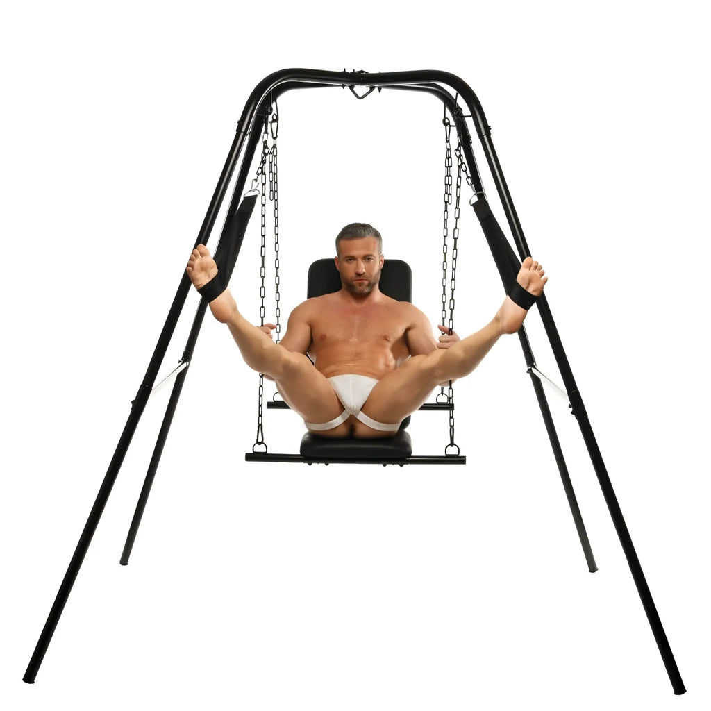 Master Series Throne sex swing with black frame, chains, and padded seat, featuring a man using the adjustable device.