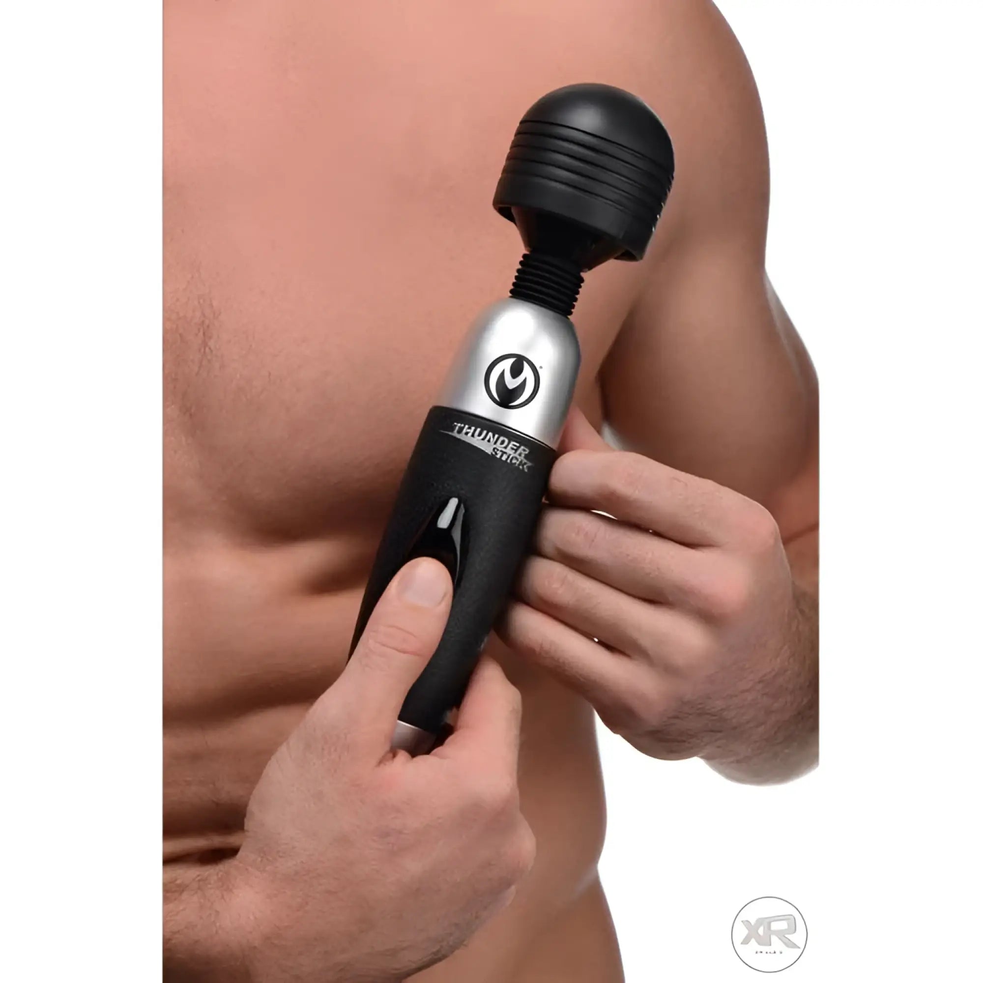 Master Series Thunderstick 2.0 black and silver power wand being held against a shirtless person's torso.