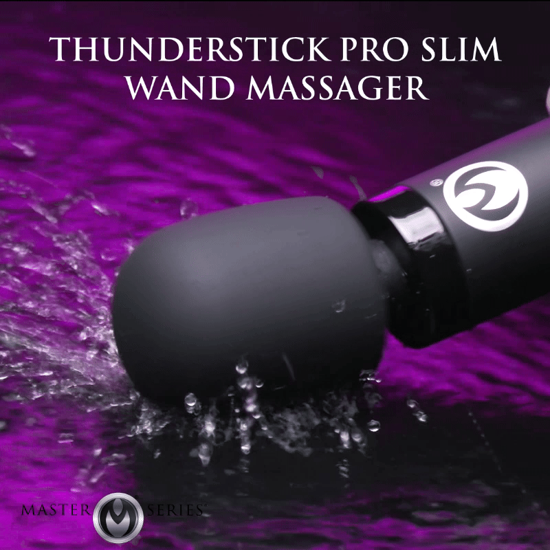 Master Series Thunderstick Pro Slim Wand Massager in matte black, splashing in vibrant purple water.