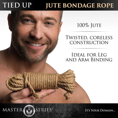 A smiling man holding a coiled, tan Master Series Tied Up Jute Bondage Rope against a white background.