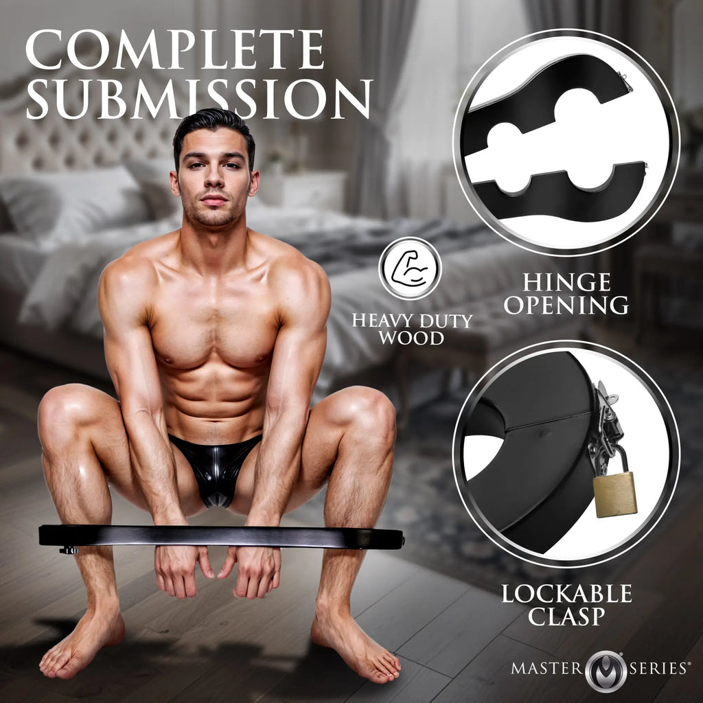 Master Series black wooden wrist and ankle stocks shown with a man in a bedroom, featuring hinge and locking details.
