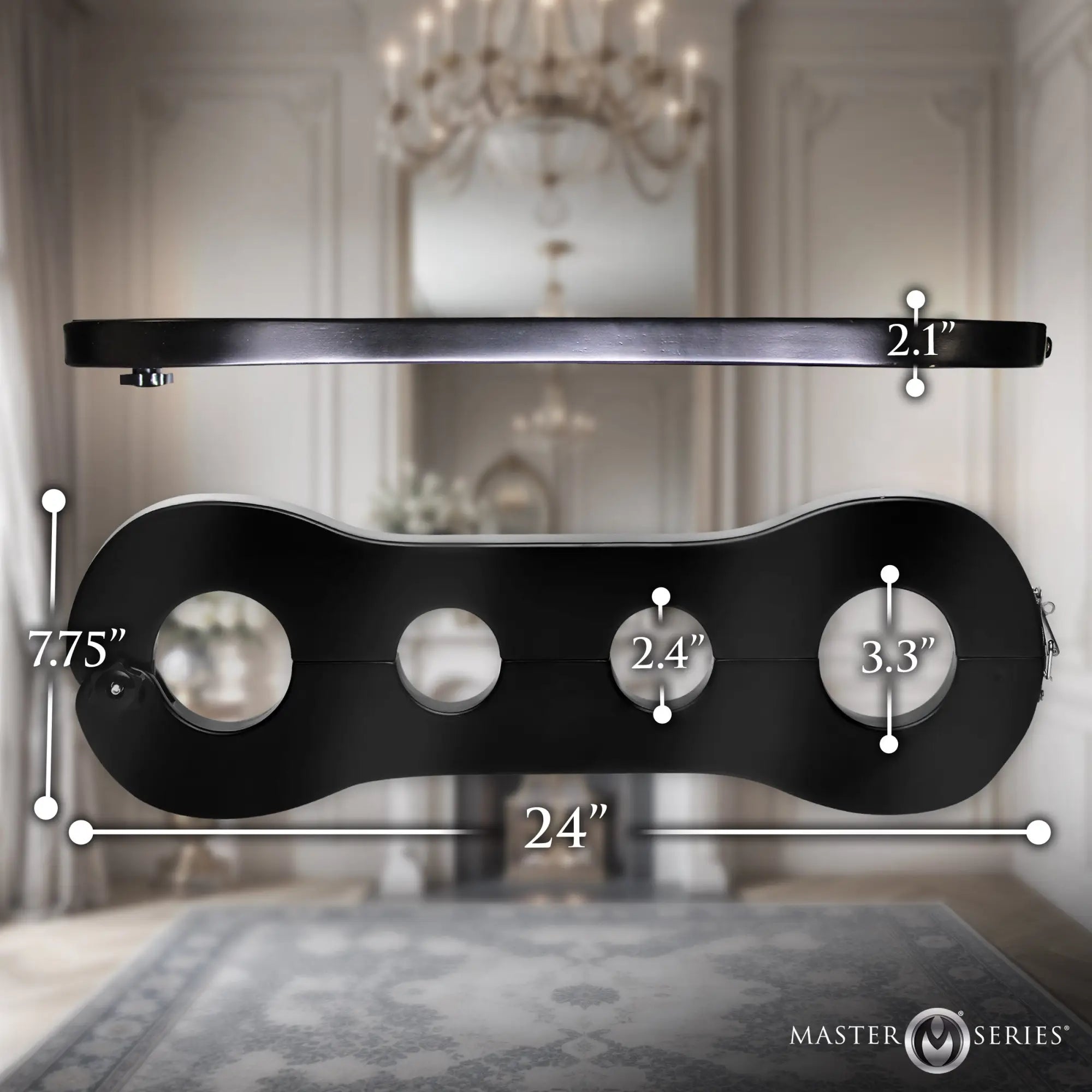 Master Series Trapped Wrist & Ankle Stocks in black, showing dimensions in a front and top view against a luxury room.