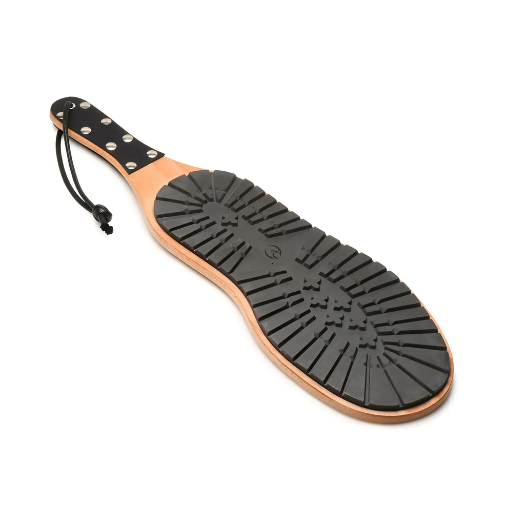 Master Series Tread Boot Paddle with a light wood handle, black studded leather grip, and a textured rubber tread face.