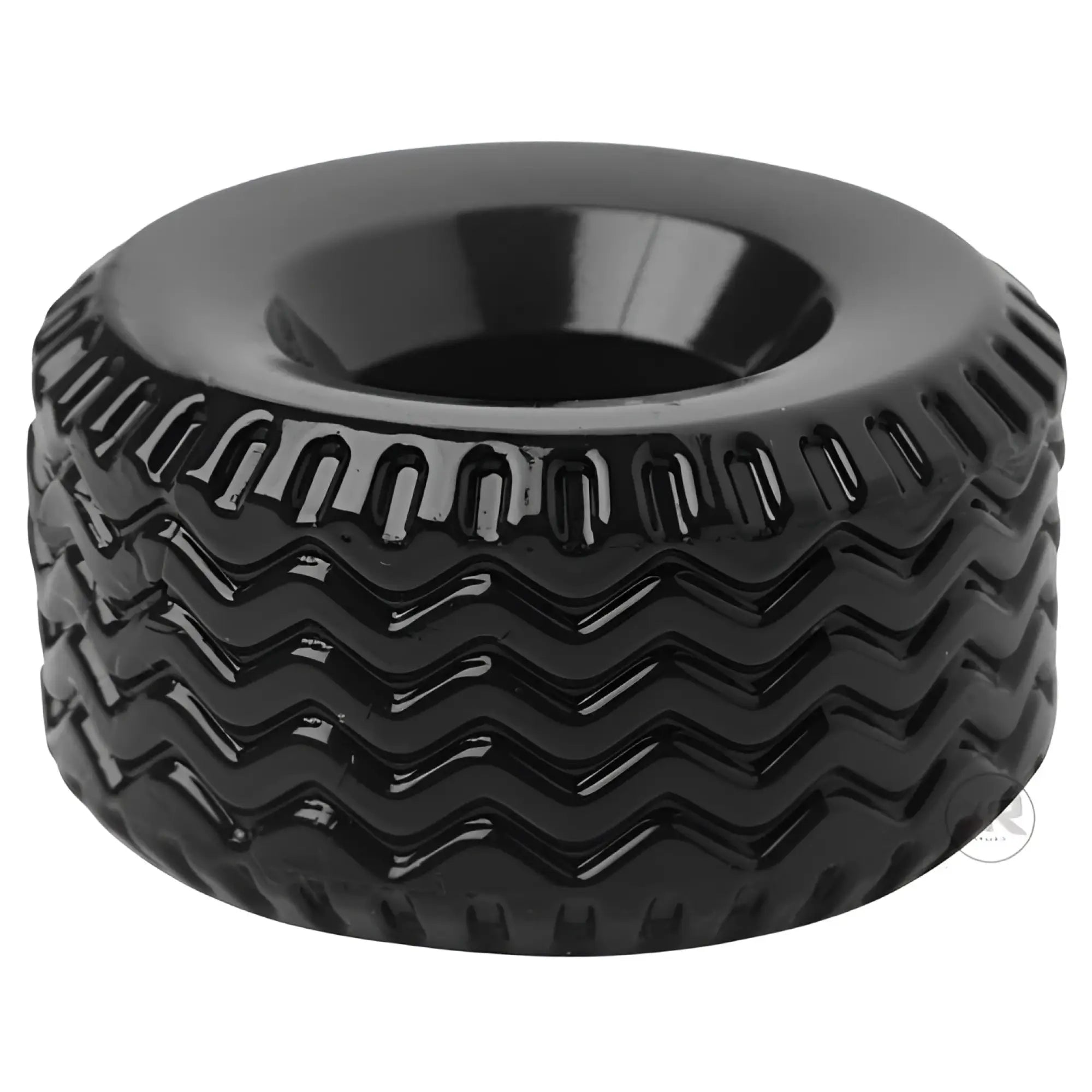 Master Series The Tread Ultimate cock ring in glossy black with a textured, wavy tire-tread pattern.