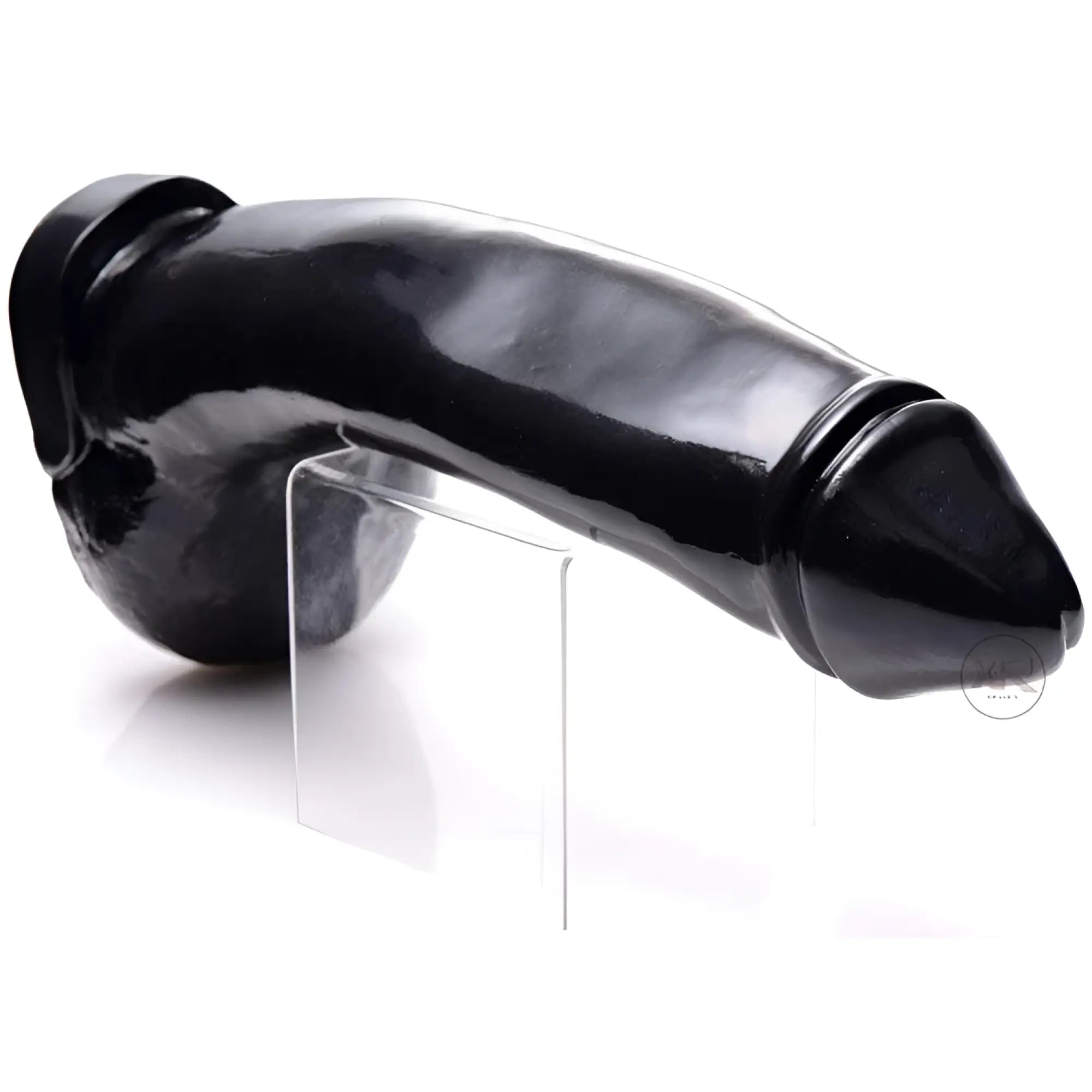 Master Series Tremendous Trevor: A realistic, glossy black dildo resting on a clear acrylic stand against white.
