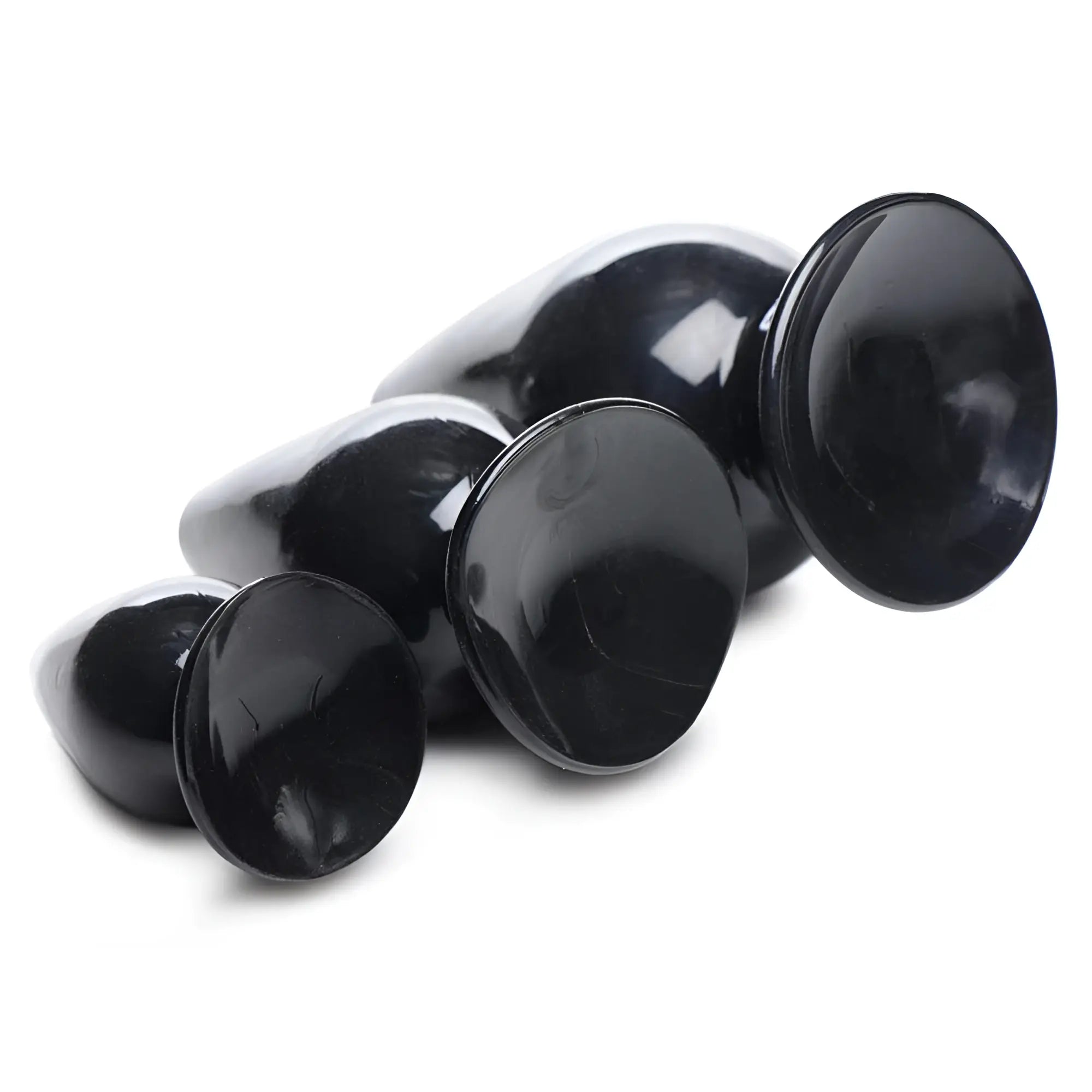 Master Series Triple Cones 3-piece set: three smooth, shiny black silicone anal plugs in graduated sizes.
