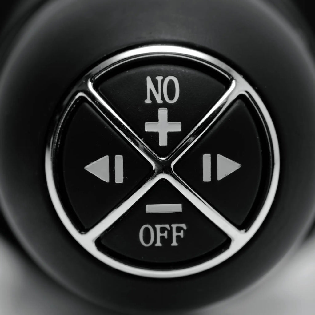 Close-up of the black circular control interface for the Master Series The Violator, featuring silver-rimmed buttons.