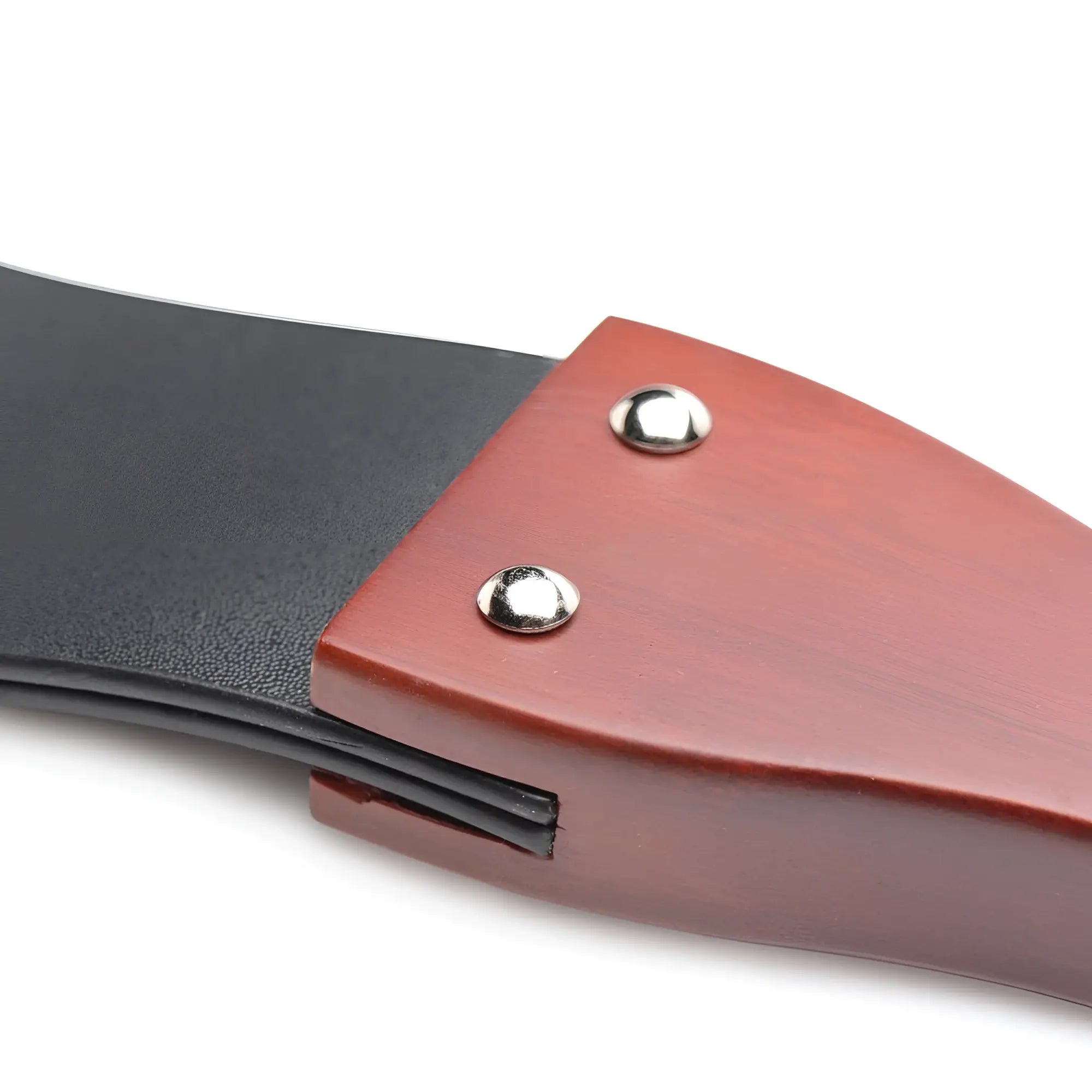 Master Series Wooden Slapper features a polished mahogany handle attached to a black leather strap with silver rivets.