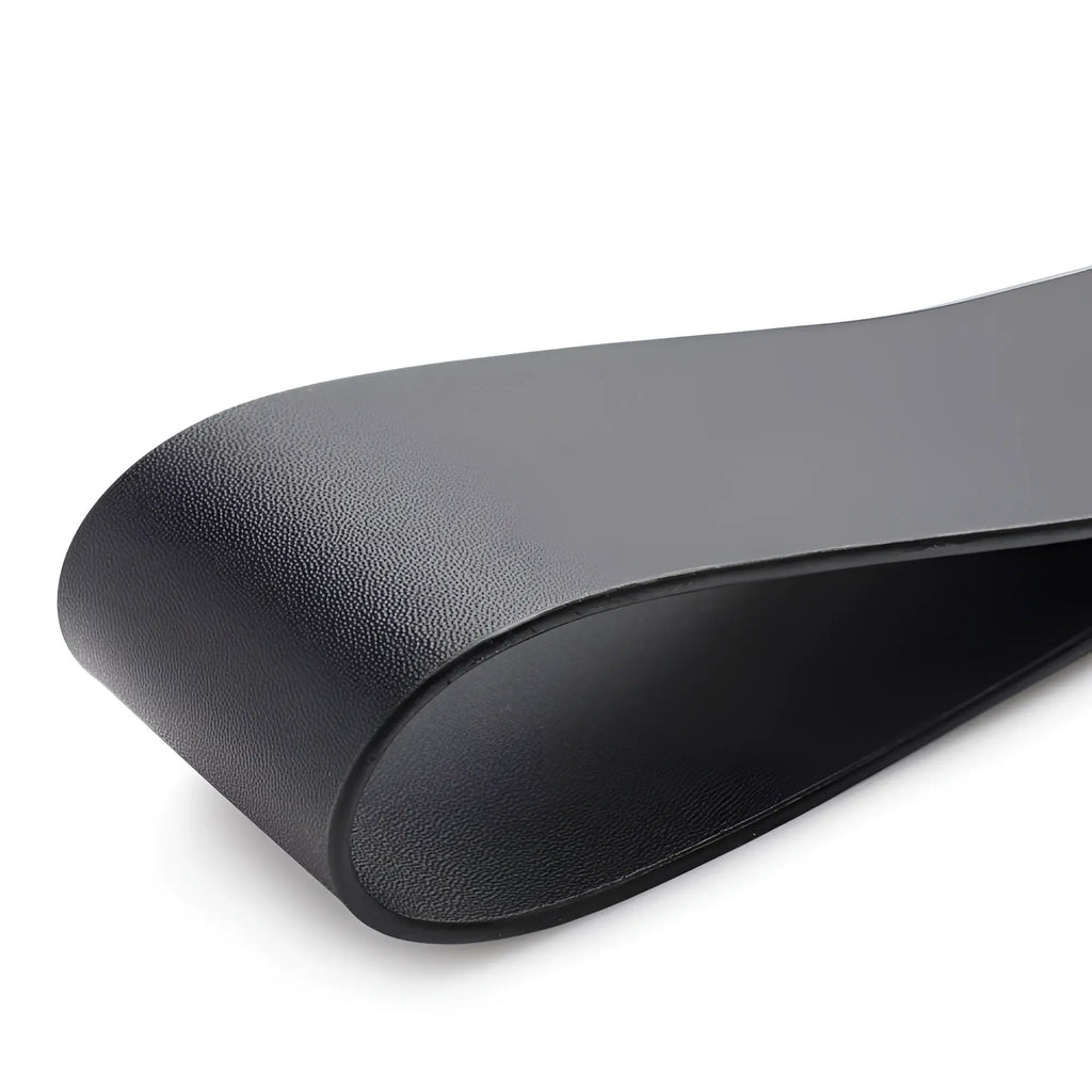 Close-up of a black, looped leather strap from the Master Series Wooden Slapper with a textured outer finish.