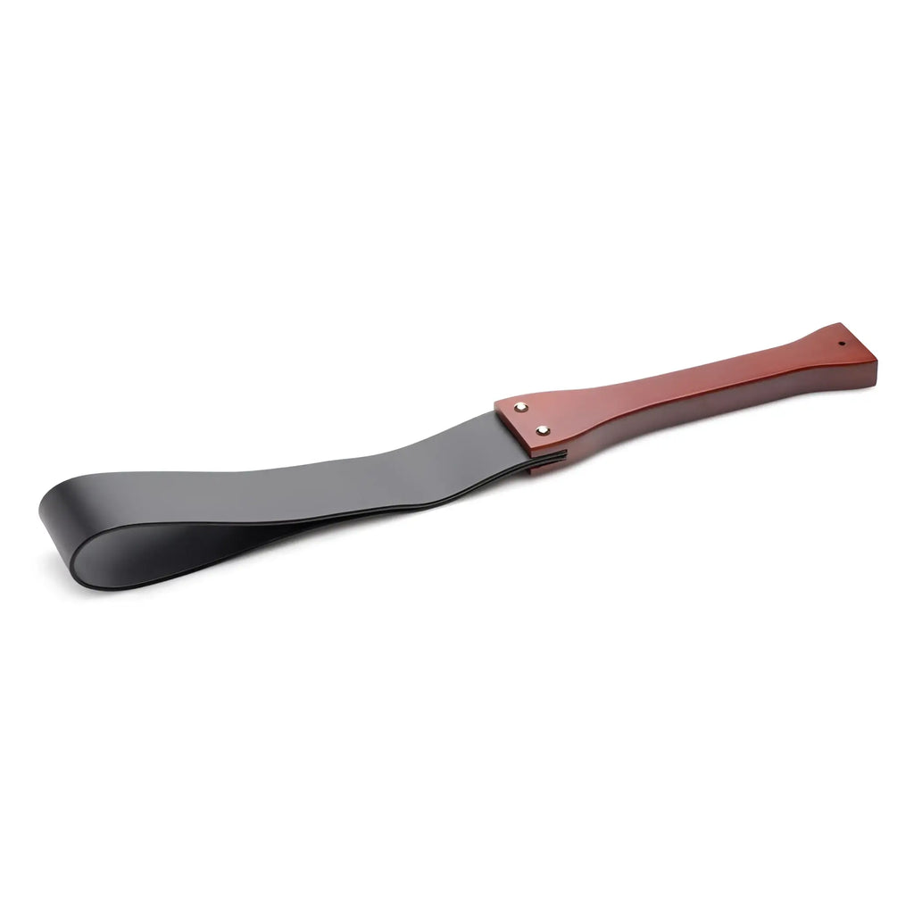 Master Series Wooden Slapper with a polished brown wood handle and a flexible, matte black flat leather strap.