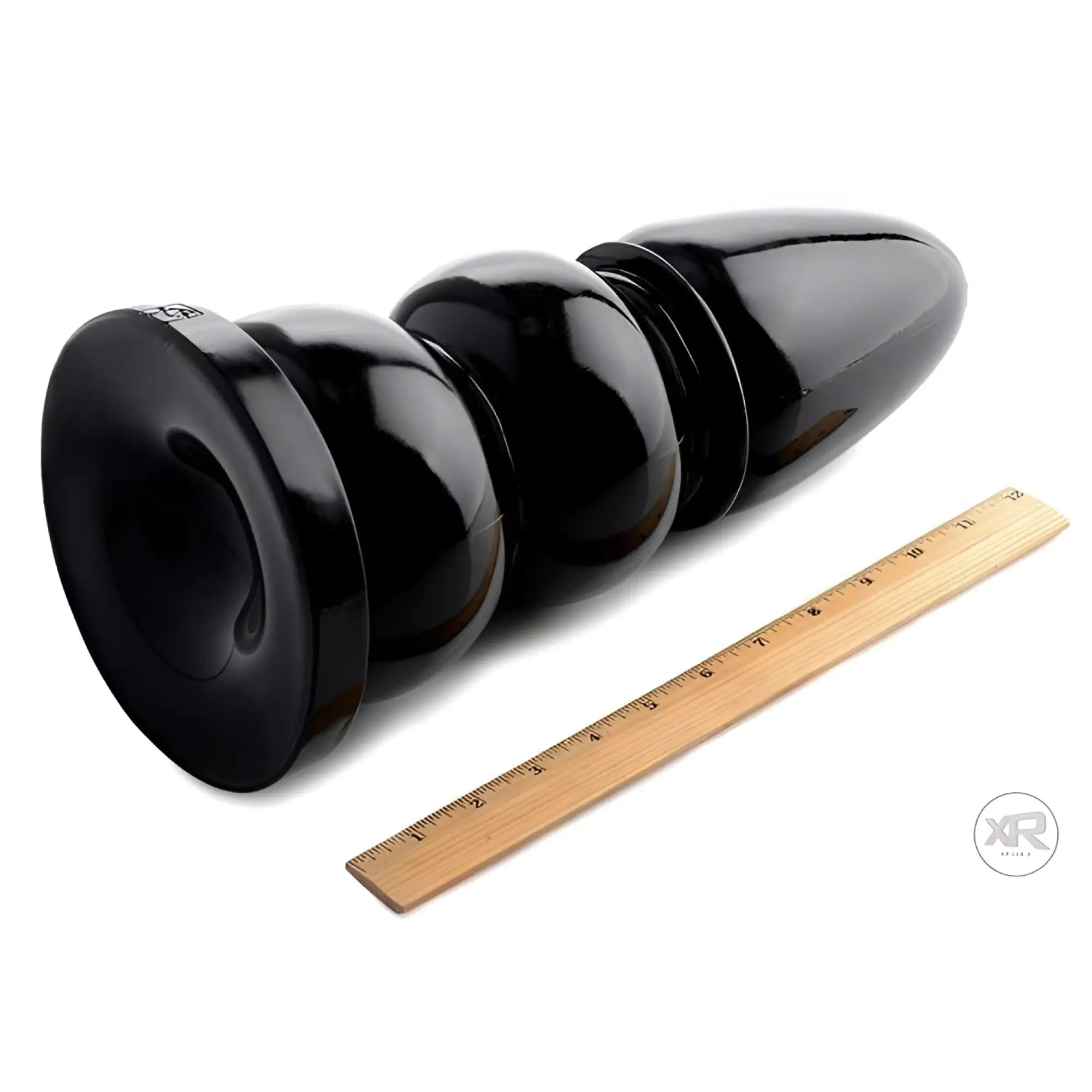 Master Series Wrecking Balls XXL giant dildo, a glossy black, multi-sphere toy shown next to a 12-inch wooden ruler.