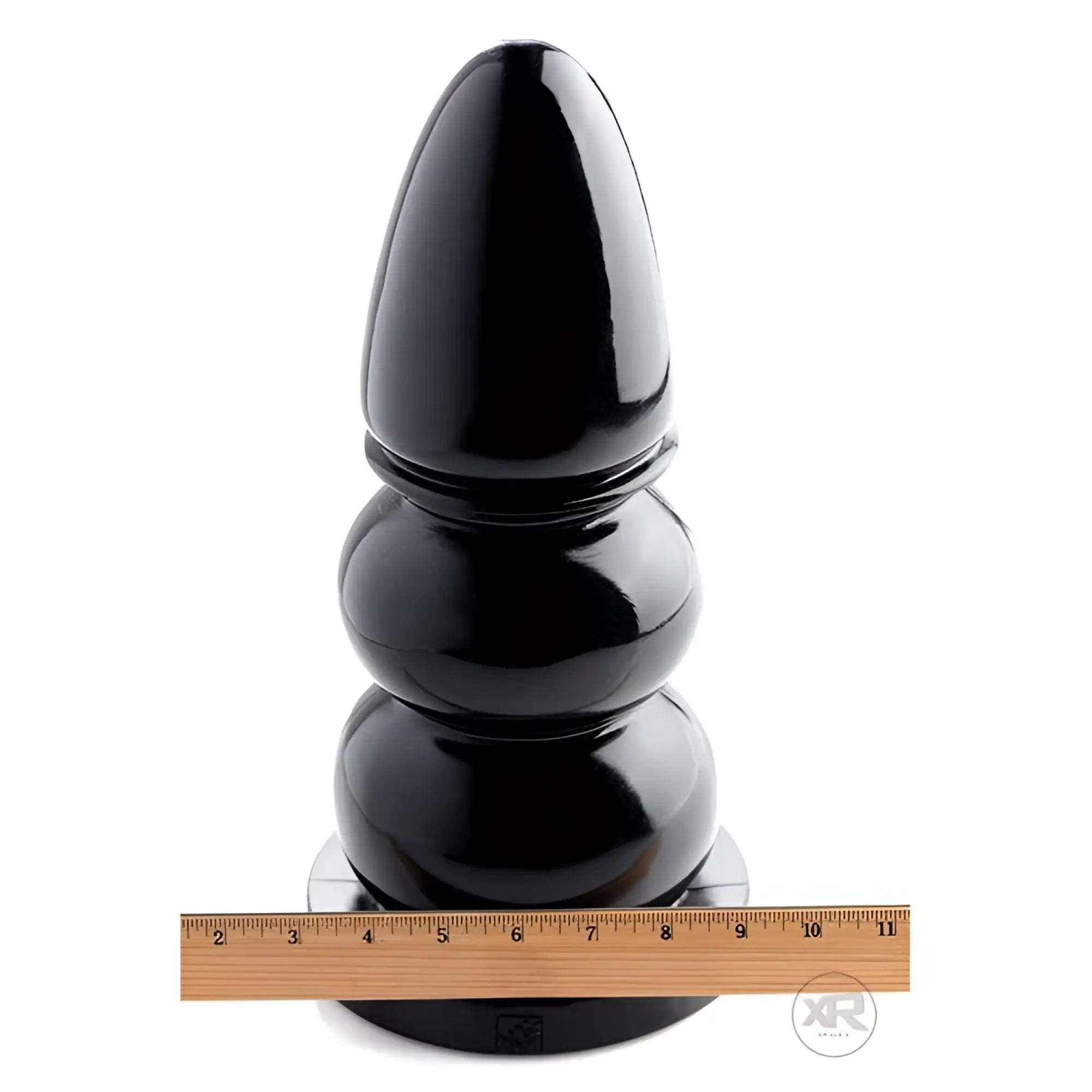 Master Series Wrecking Balls XXL giant black dildo with three bulbous segments, shown standing next to a measuring ruler.