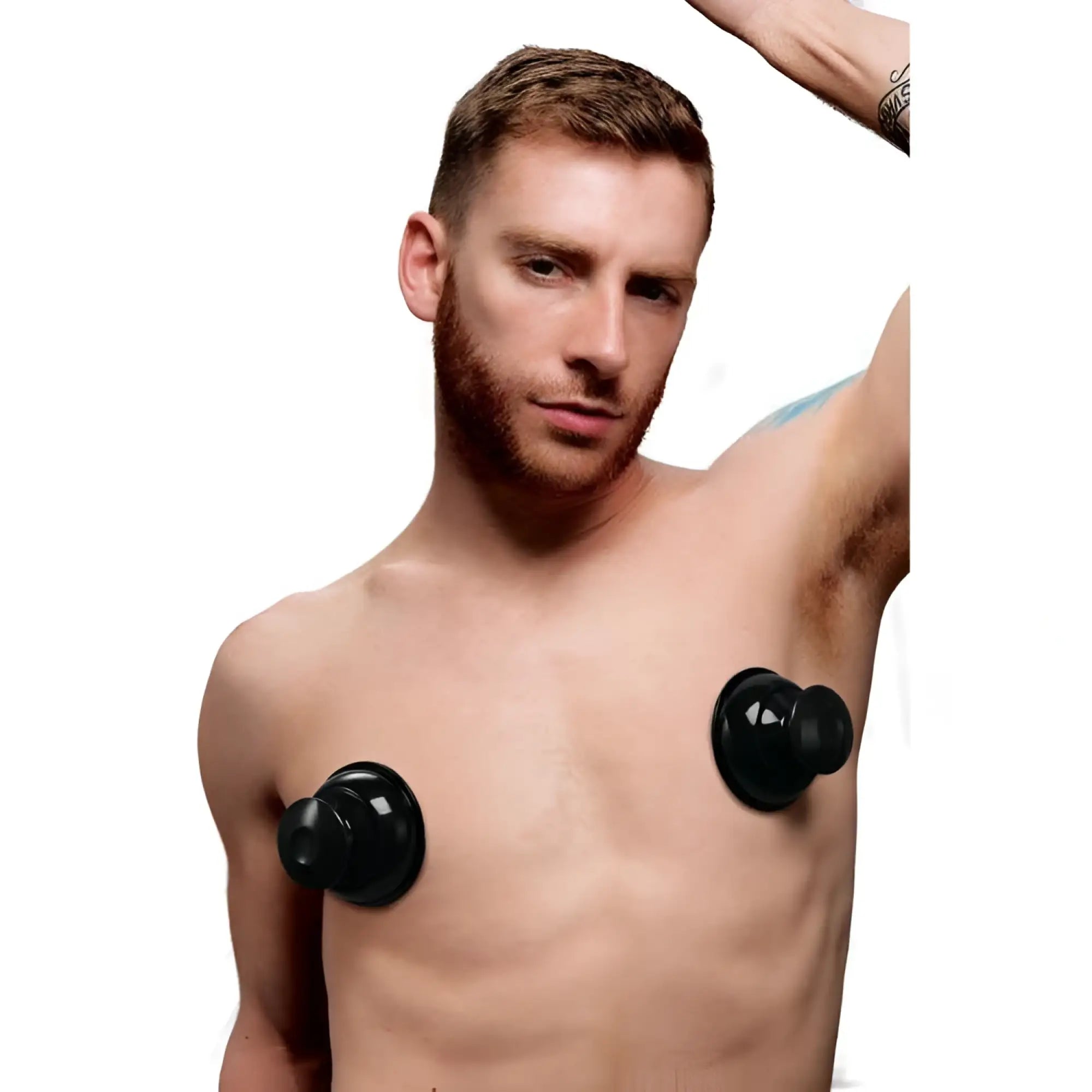 A man wearing a pair of black, XL Master Series Plungers Extreme Nipple Suckers on his chest.