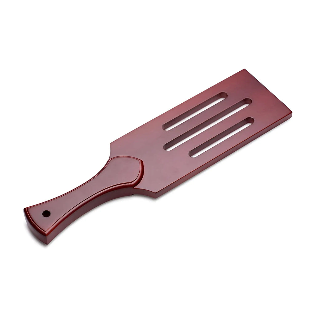 Masters wooden paddle in red with three elongated slots and a rounded handle for versatile use