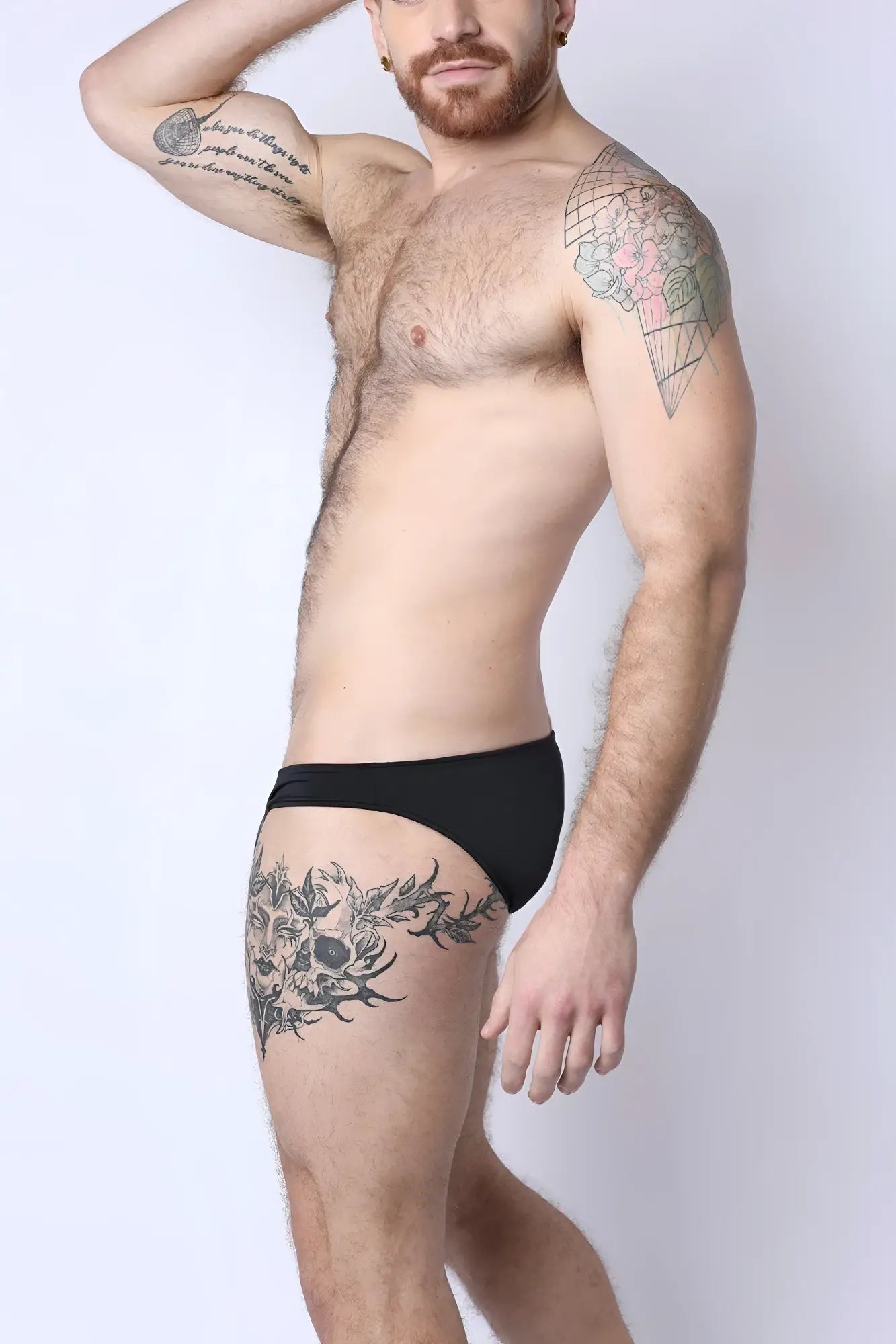 Black briefs with sleek minimalist design from Mauii side tie reversible bikini collection