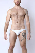 White form-fitting reversible bikini swim trunks with a side tie from Maui side tie collection for beachwear use