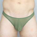 Mckillop GGUS Gravity Enhance thong in olive green sheer mesh with a solid fabric waistband shown from the back