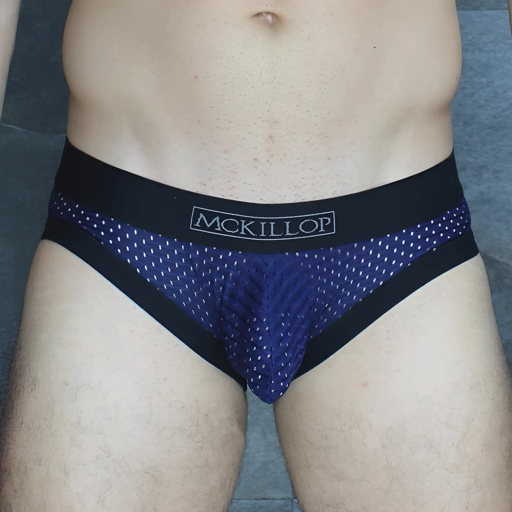 Dark blue mesh briefs with black trim and white mckillop logo on waistband from mckillop mckobpl brief collection