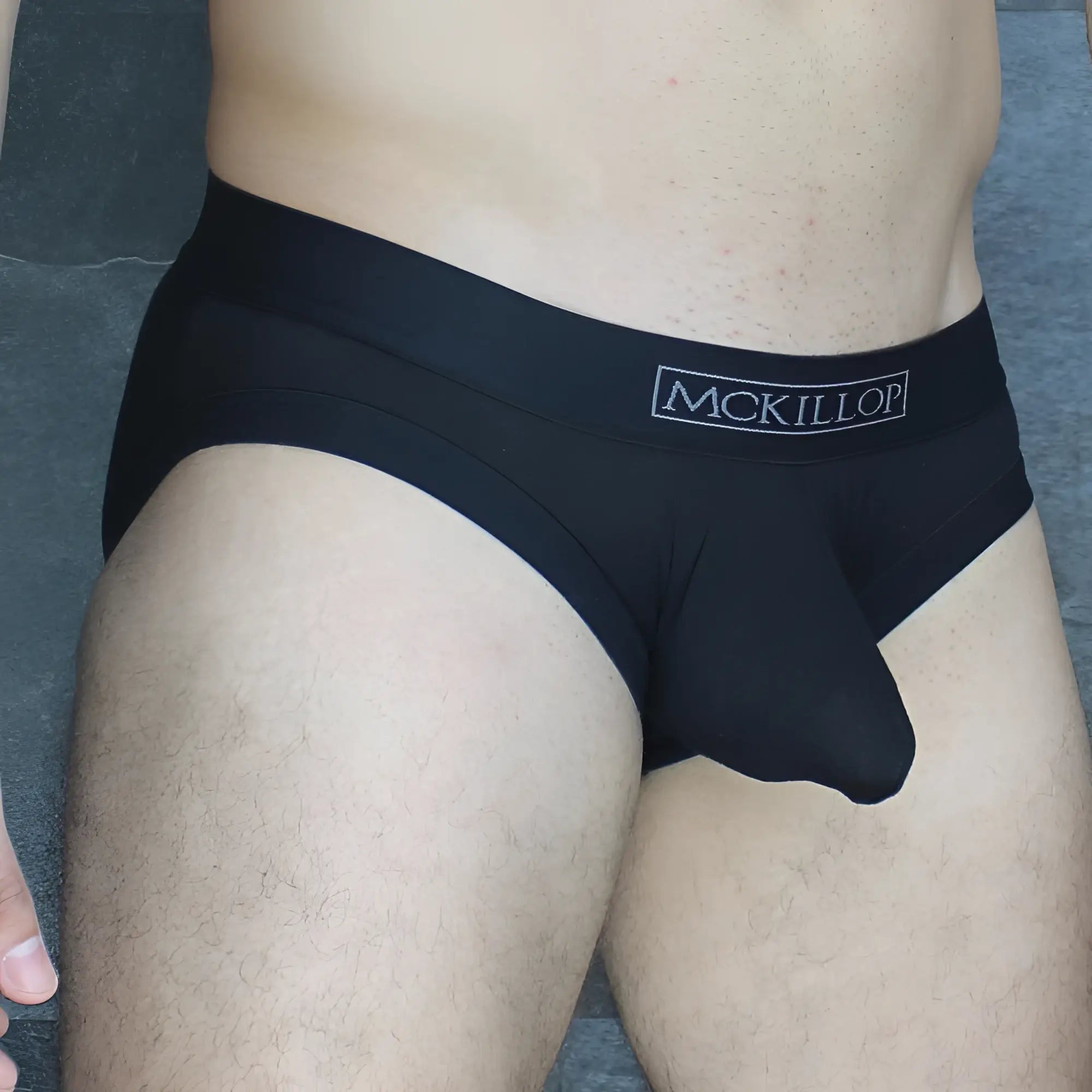 Black mckillop obmo hoist brief modal mens briefs in smooth form-fitting black modal fabric with subtle waistband logo