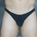 Black form-fitting thong made of smooth modal fabric shown from the back in mckillop vtmo hoist thong modal product image