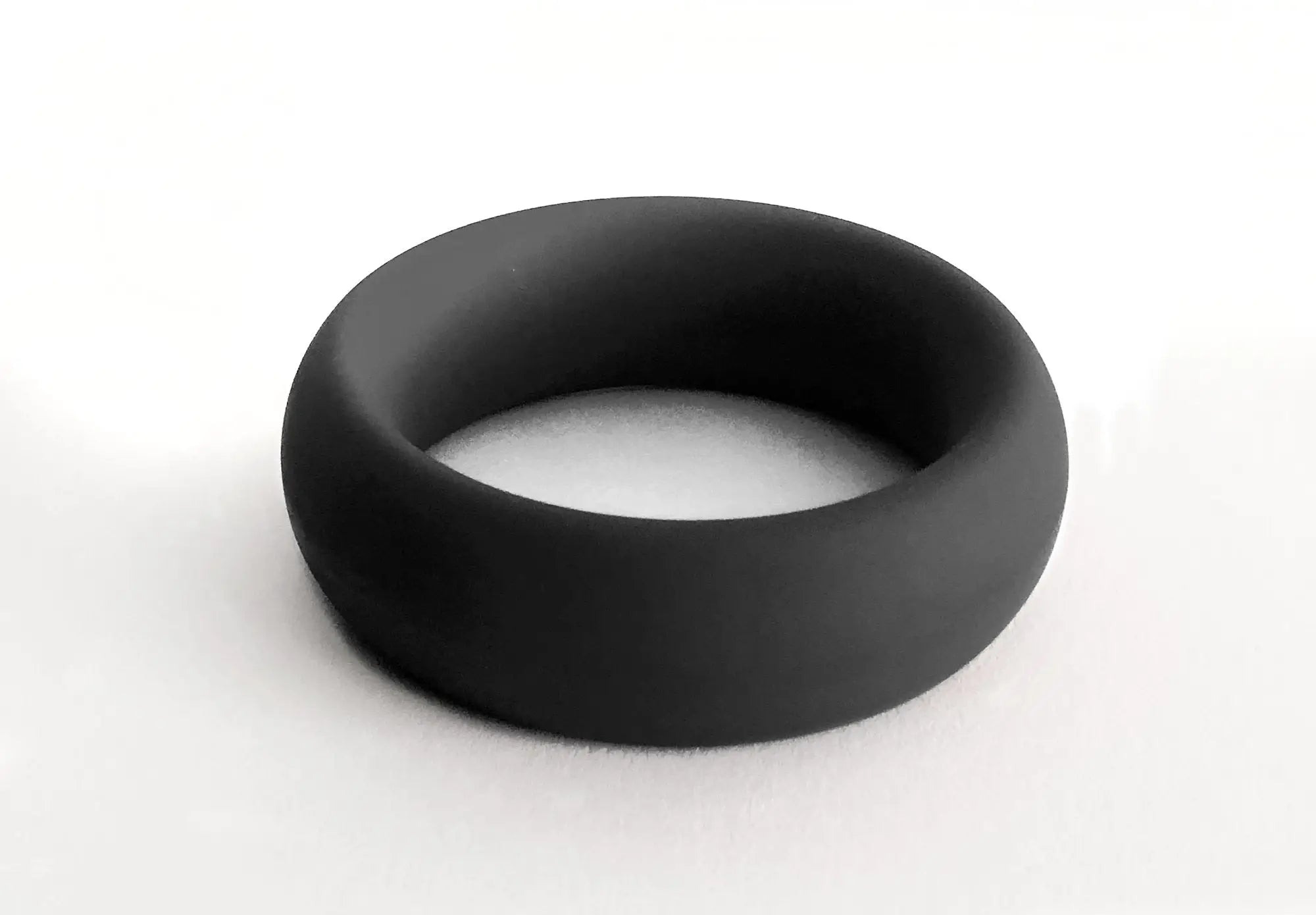 Black silicone meat rack ring with smooth matte finish and rounded edges designed for comfortable wear