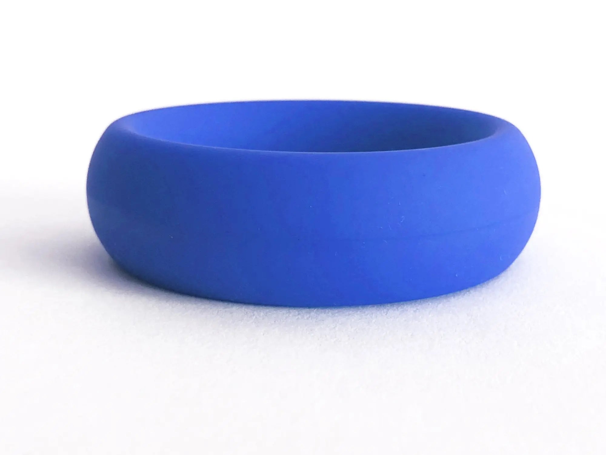 A solid blue silicone wedding band with a smooth matte finish from MEAT RACK blue collection