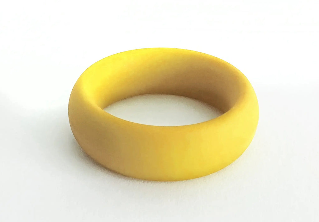 A smooth solid yellow silicone ring with a matte finish from the meat rack collection