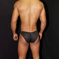 Black mesh men's underwear by Arroyman featuring a snug fit and breathable material shown from the back.