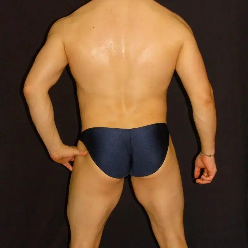 Navy men's bikini underwear by Arroyman featuring a snug fit and smooth fabric shown from the back on a model.