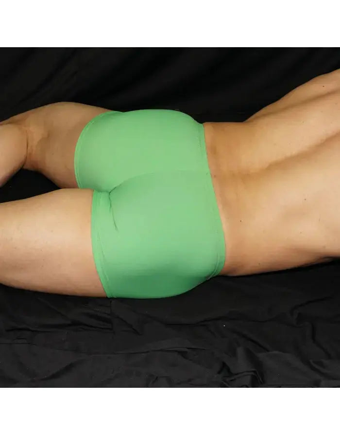 Green boxer underwear shown on a model featuring a snug fit and smooth fabric by Arroyman.