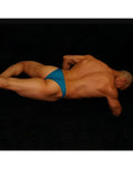 Calypso blue micro bikini underwear by Arroyman featuring a low-rise cut and smooth fabric shown on a model from behind.
