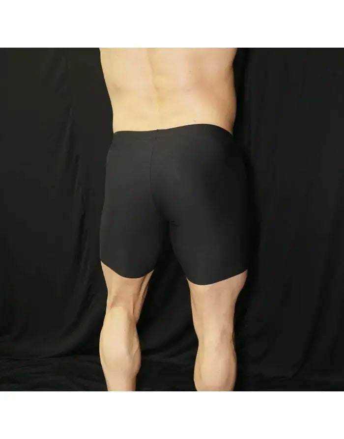 Black compression cycle shorts by Arroyman featuring a snug fit and smooth fabric shown from the back on a model.