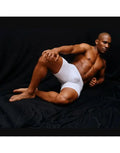 White compression shorts on a model featuring a snug fit and smooth fabric by Arroyman.