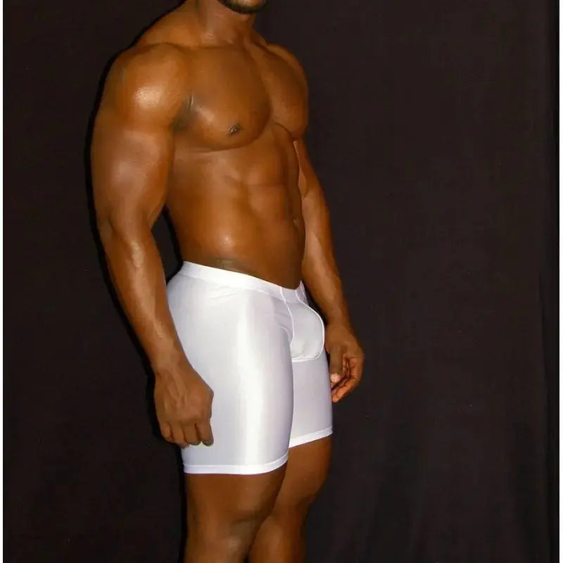 White compression shorts by Arroyman featuring a snug fit and smooth fabric shown on a model from the side.